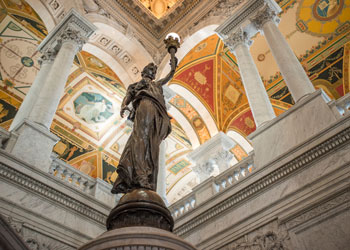 Interior of the Library of Congress with statue holding light