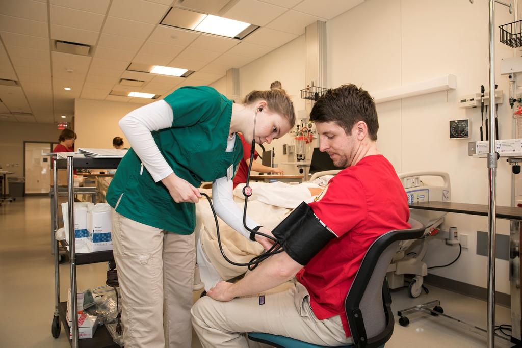 Nursing students doing simulation lab