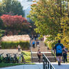 Students walking up stairs outdoors on mason campus
